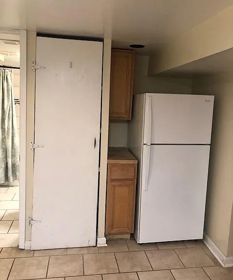 Kitchen and door to bathroom on the Left