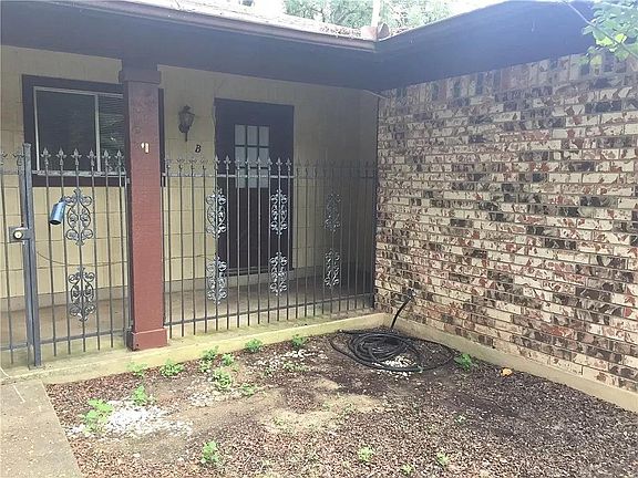 Front porch behind a gate for privacy.