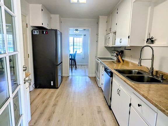 The kitchen opens up to a large backyard.