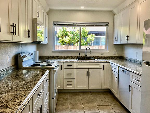 Spacious kitchen brand new from floor to ceiling. Lots of cabinets and counter space!