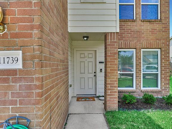 Beautiful Brick and wood exterior welcomes upon arrival.
