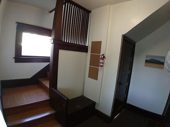 Common area in front entry. Door leads to basement laundry (free)