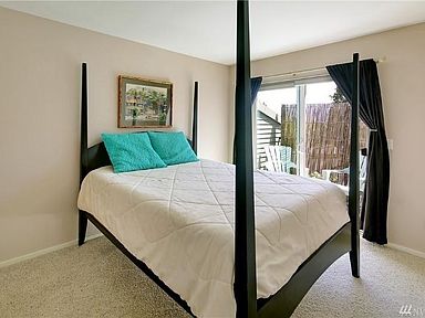 Bedroom with sliding glass door out onto the deck.