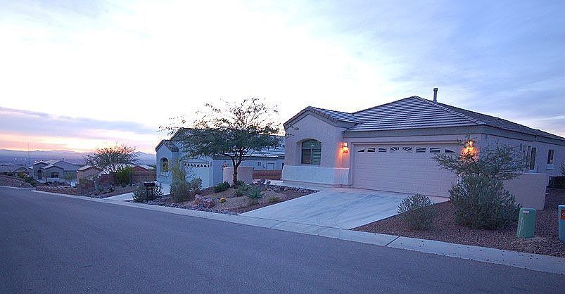 Welcome to 5371 W. Arid Canyon Dr. w/common area next door & elevated site