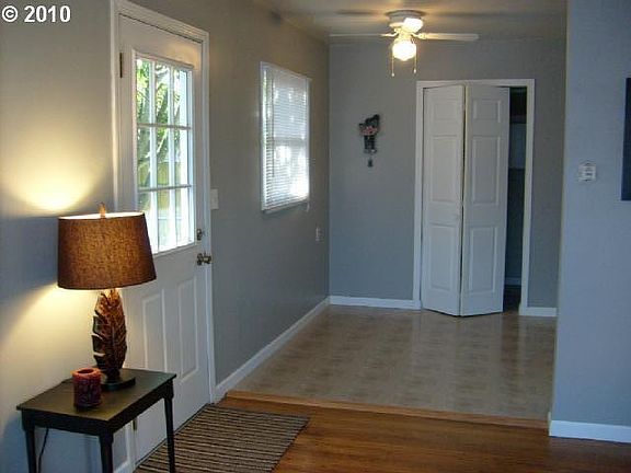 Side door and eating area of kitchen-- washer/dryer behind folding door.