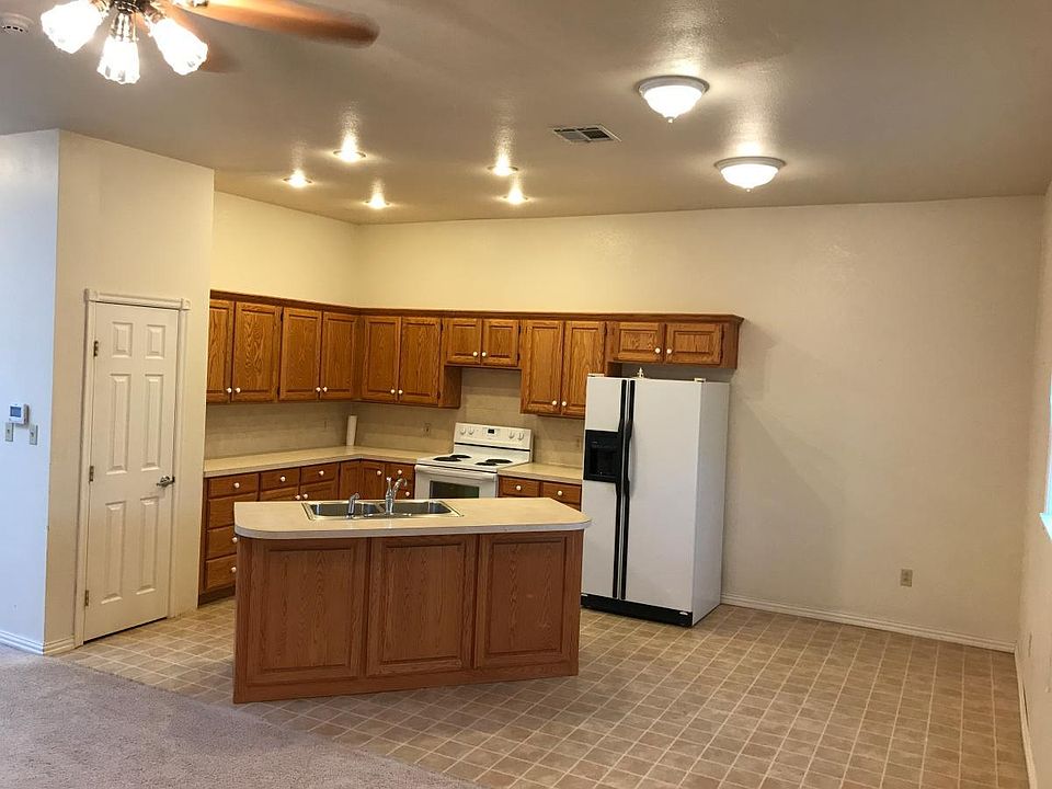 Kitchen with center island open to living area