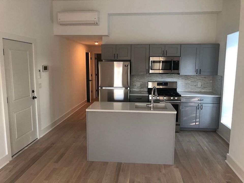 Open concept kitchen, dining and living area