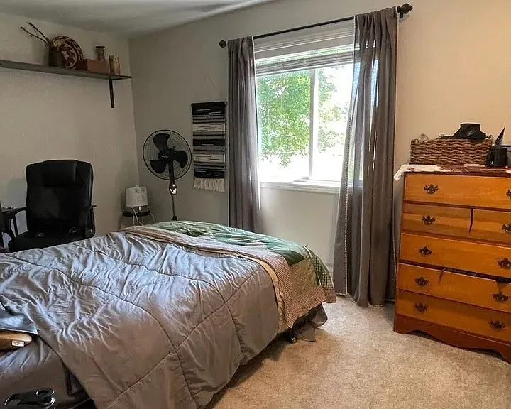 Transform your living space at LS Capital Group with this inviting bedroom featuring ample natural light, personalized decor, and functional furnishings. Feel at home in a cozy atmosphere that enhances your lifestyle. Schedule a visit today!
