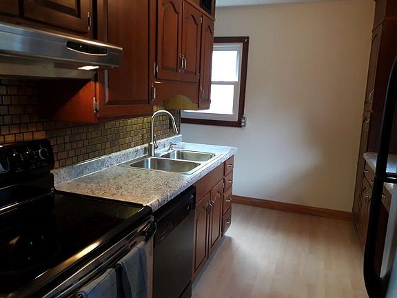 Newly remodeled kitchen, with view towards side entrance and laundry room