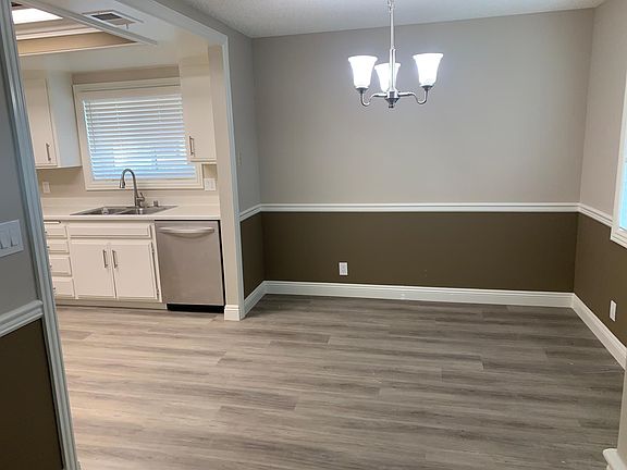 View of dining area with kitchen on Left side as seen from the main entry