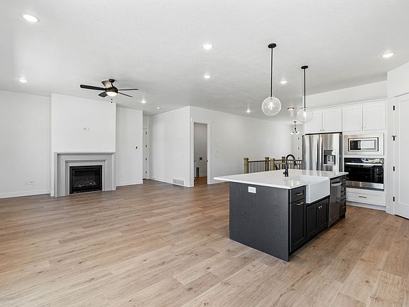 The family room is large and has lots of windows and a gas fireplace.