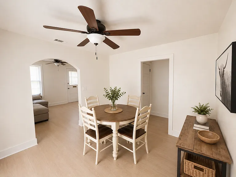 View of dining area from kitchen. Opening leads into hallway to bedroom 2 and bathroom 2