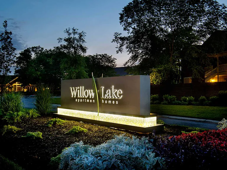 Community entrance sign at dusk