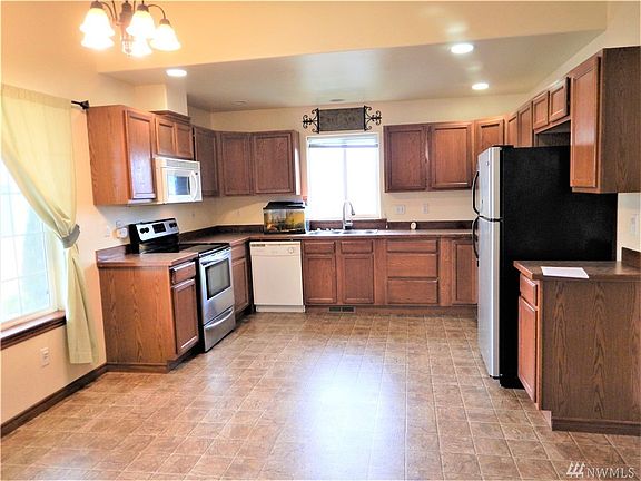 another view of kitchen, you can see the eating area off the left of the kitchen under the large window