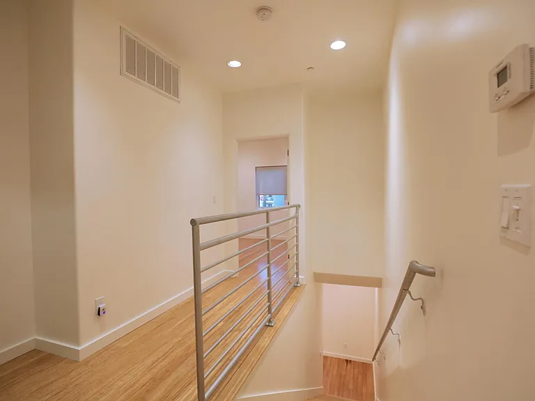 Hallway to Front Bedroom; Stairway Down to Living Room