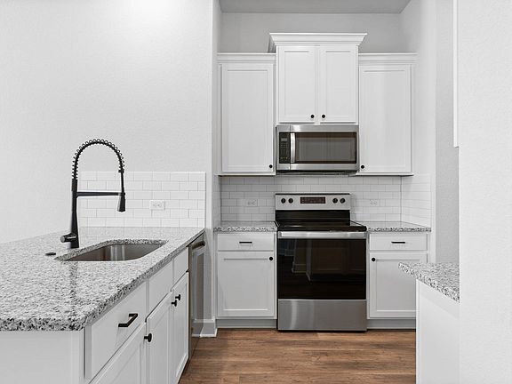 The kitchen has a wonderful breakfast bar.