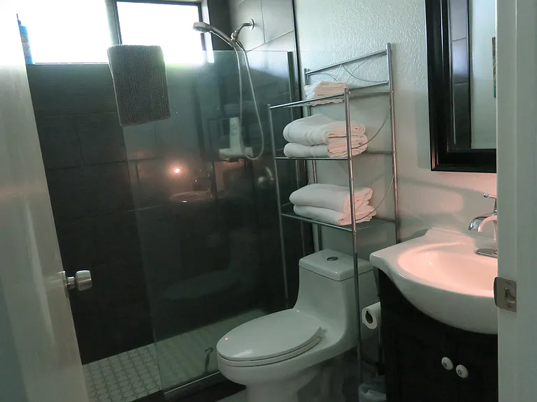 A walk-in shower to refresh after a trip to the beach.