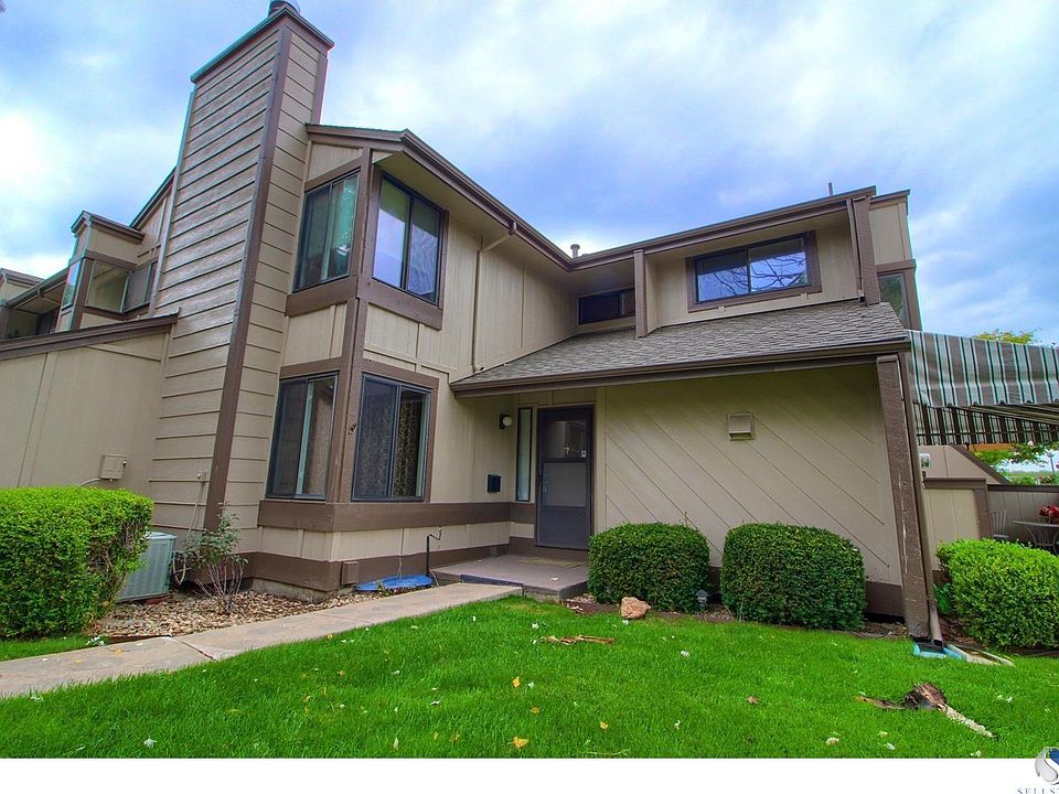 Wonderful end unit with a covered patio!  You won't believe the amount of space inside!