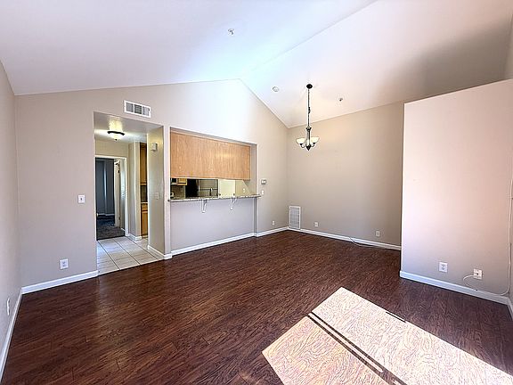 Dining Area & Family Room with Laminate Wood Floors