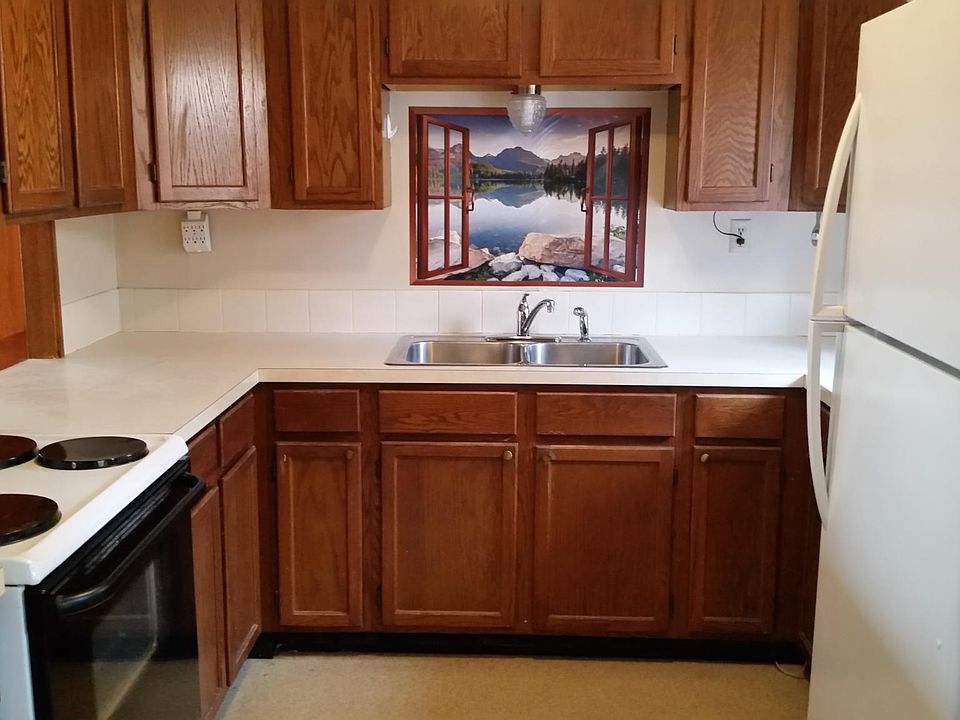Kitchen view showing refrigerator..