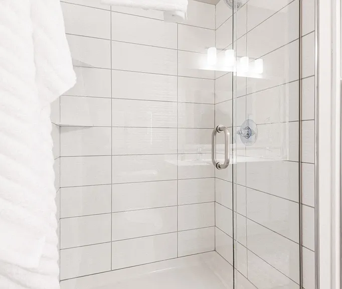 Select homes include free-standing showers with tile surrounds.