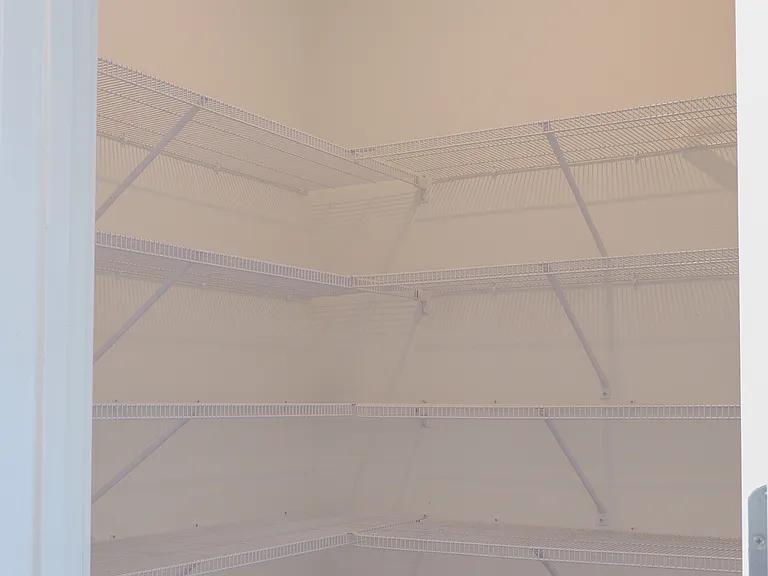 Spacious walk in pantry with tons of storage for all your kitchen essentials