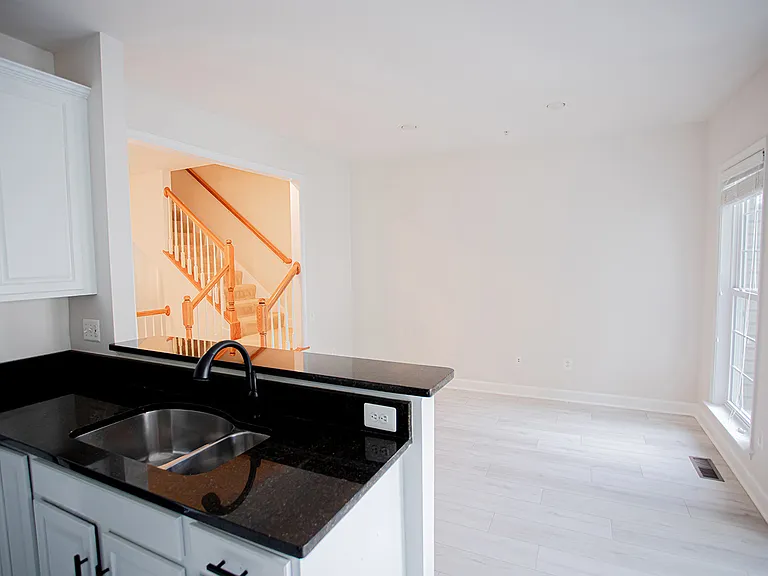 Imagine entertaining in this sun filled kitchen, while guests are enjoying a drink at the counter, or making a meal while watching your kids play