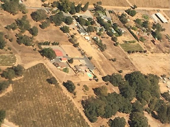 Over view of property. Home in center closest to vineyard.