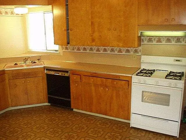 Inside kitchen with stove and dishwasher
