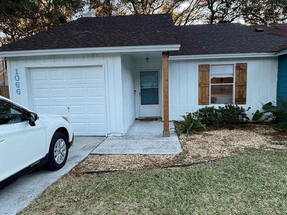 entrance with driveway and 19 ft deep 1 car garage with opener. washer and dryer option available