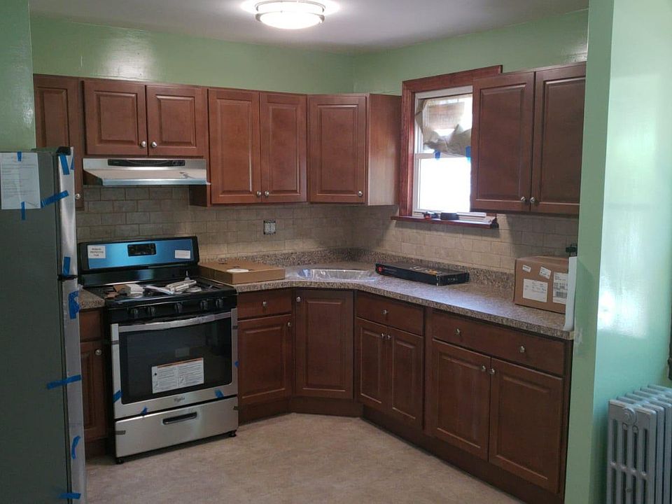 Brand new kitchen with brand new stainless steel appliances.