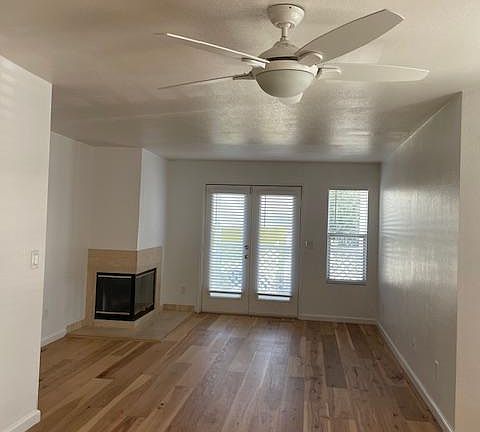 There are new hardwood floors throughout the unit. The living room has a fireplace and access to the backyard.
