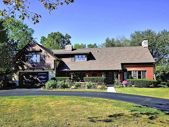 Welcome Home! Great circular driveway and deep two-car garage which has a concrete ceiling & cement block walls. Family-friendly neighborhood as well!