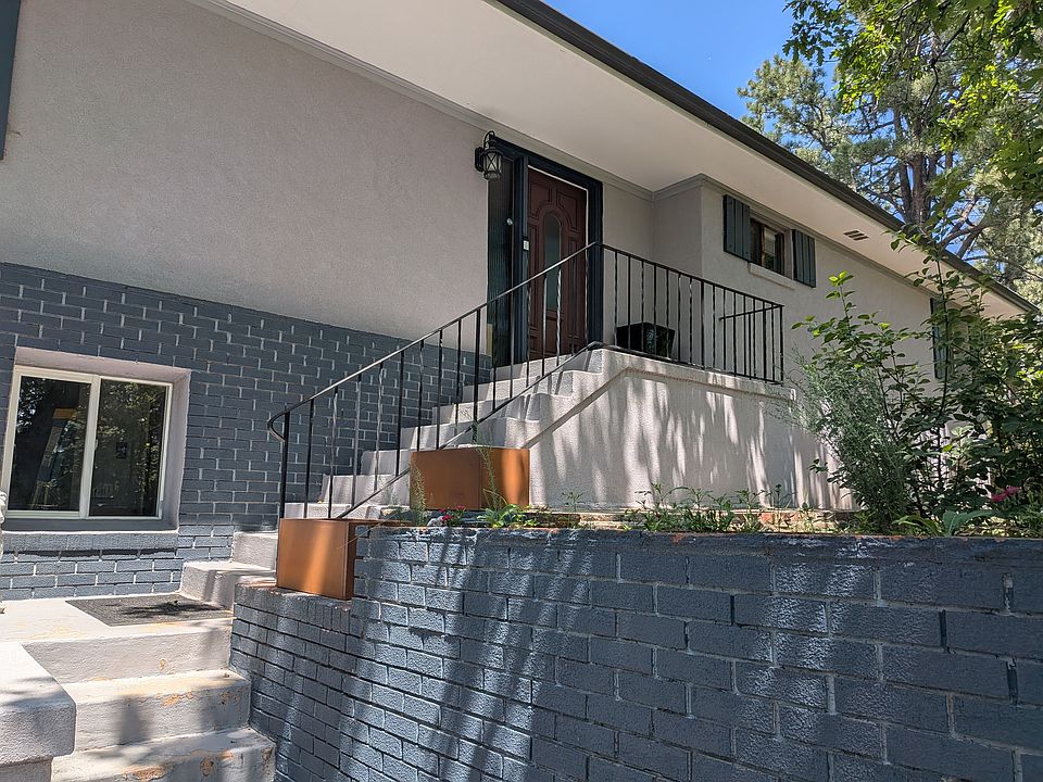 Midcentury modern home in Cheyenne Canon. This Raised Ranch is adjacent to the Stratton Open Space in District 12.