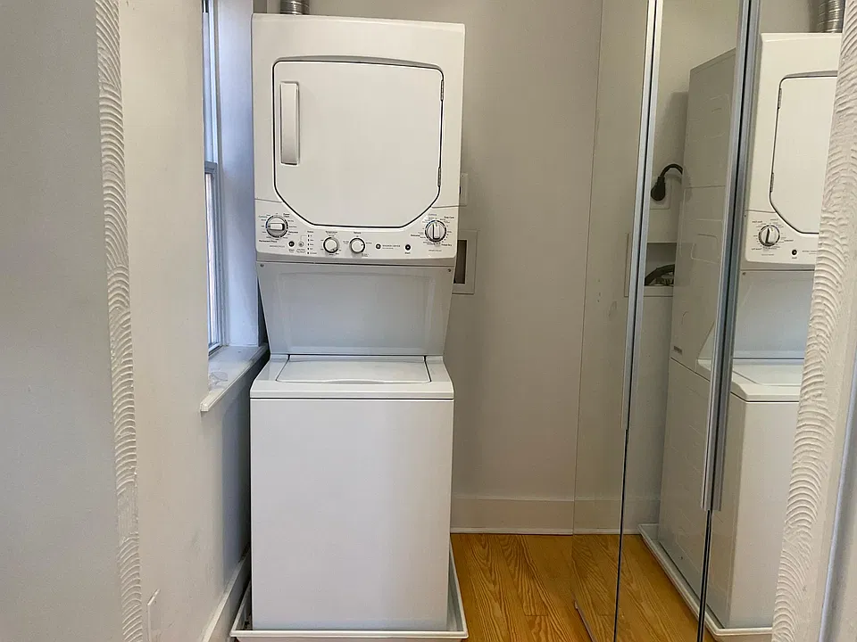 Walk-in closet with w&d.