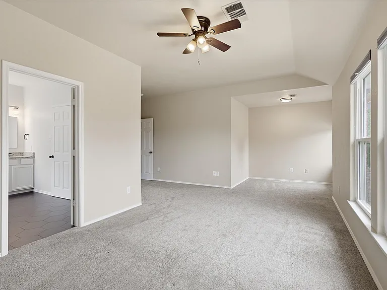 Primary bedroom with additional reading nook