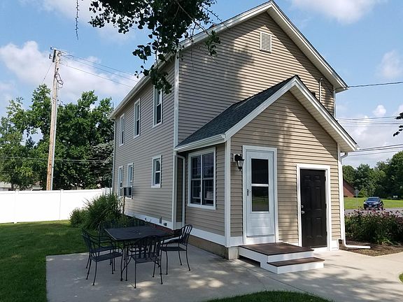 Side entrance is used as main entrance to the house. Includes a side porch for shoes/coats and storage.