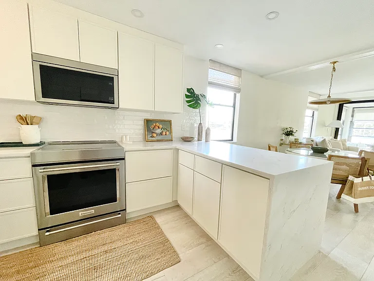 Beautifully designed, functional kitchen with quartz waterfall countertop and Kitchen Aid appliances - and all the cooking tools needed to host dinner for your friends/family