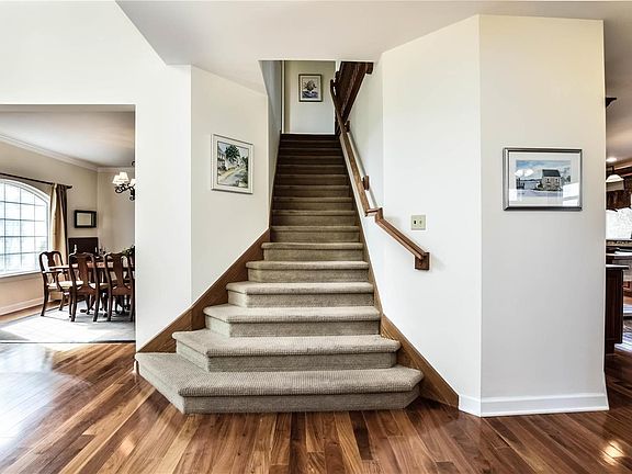 Carpeted stairway leads to the 4 spacious bedrooms and fabulous bonus room upstairs.