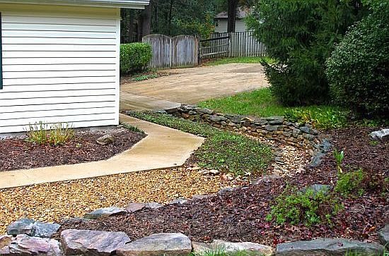 Another rockwall is located in the front of the home