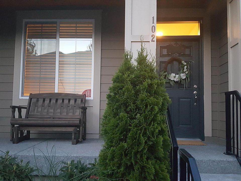 front porch with room for seating and handrails on entry stairs