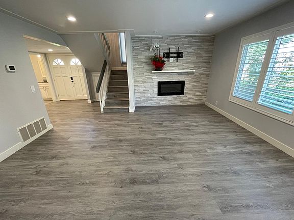 Living room with electric fireplace and TV wall mounting kit