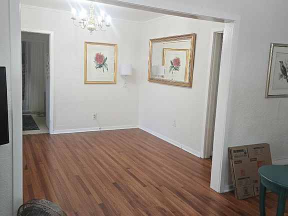 View from front iving room to the dining room and door to the kitchen