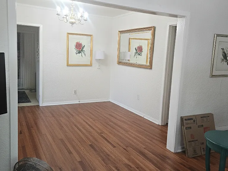 View from front iving room to the dining room and door to the kitchen