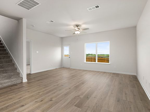 The living room is spacious and sits right off of the dining area.