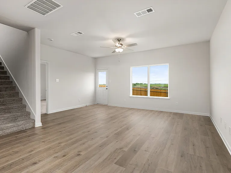 The living room is spacious and sits right off of the dining area.