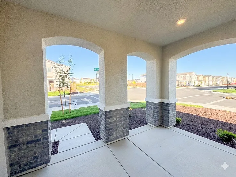 Front entrance with elegant covered patio