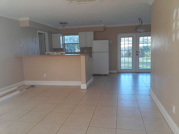 standing in front door