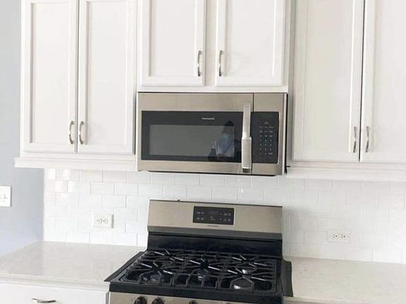 Kitchen Microwave and Gas Stove