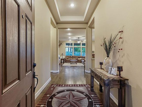 Foyer is accented nicely with coffered ceilings.